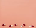 Scattering of red and white drug capsules Royalty Free Stock Photo