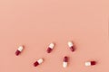 Scattering of red and white drug capsules Royalty Free Stock Photo