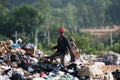 Scavenger at the landfill site Royalty Free Stock Photo