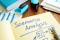 Scenario Analysis with graphs and stack of paper