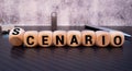 SCENARIO word on wooden cube isolated on orange background