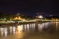 Basilica di San Lorenzo and the river Adige by night