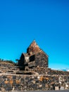 Scene of the ancient Sevanavank Monastery on the hill, blue sky background, vertical. Historical churches and cathedrals at the Royalty Free Stock Photo