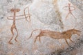 A scene of animal hunting performed ocher on the wall of the cave. Royalty Free Stock Photo