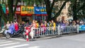 Scene asian street with motorbikes and mopeds at stop near crosswalk in Guilin city of China