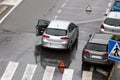 Scene of a broken down car on a city street road Royalty Free Stock Photo