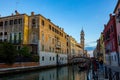 Scene of the city of Venice, Italy, with an array of colorful buildings along the banks of a river