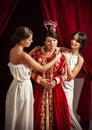 Scene of clothing of aristocratic woman by her servants Royalty Free Stock Photo