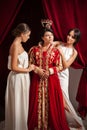 Scene of clothing of aristocratic woman by her servants Royalty Free Stock Photo