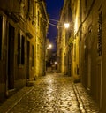 Scene of a cobblestoned street in the historic center of Rovinj in Croatia during night Royalty Free Stock Photo