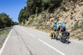 Scene of a couple of cyclists on tandem bicycle in La Garrotxa, Girona, Spain