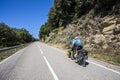 Scene of a couple of cyclists on tandem bicycle in La Garrotxa, Girona, Spain