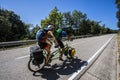 Scene of a couple of cyclists on tandem bicycle in La Garrotxa, Girona, Spain