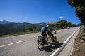 Scene of a couple of cyclists on tandem bicycle in La Garrotxa, Girona, Spain