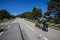 Scene of a couple of cyclists on tandem bicycle in La Garrotxa, Girona, Spain