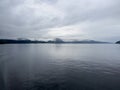 A scene of a ferry on a rainy day crossing the Sogn Fjord, Norway Royalty Free Stock Photo