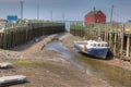 Scene at Halls Harbour, Nova Scotia boat at low tide Royalty Free Stock Photo