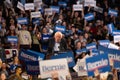 Scene from the heated rally of Bernie Sanders with the crowd holding banners actively cheering