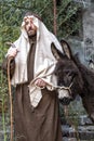 Scene of Jesus life. The flight into Egypt. Joseph and a donkey