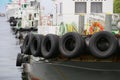 A scene of many tires on the harbor ship Royalty Free Stock Photo