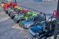 Scene of many types of electric toy cars display for kids to rent at park