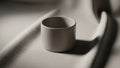 The scene is minimalist emphasizing the form and contrast between the cup Royalty Free Stock Photo