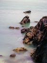 scene of a rocky beach on sunny day at pulau sayak