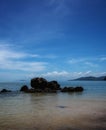 scene of a rocky beach on sunny day at pulau sayak