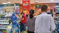 Shenzhen, China: People check out at the supermarket