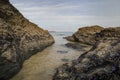 Cornish beach scene in November showing rocks and the sea Royalty Free Stock Photo