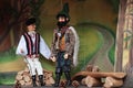 Scene from puppet theater - muddleheaded peasant son and bandit with axe Royalty Free Stock Photo