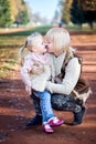Scene of quiet family happiness and love. Happy caucasian mother holding her little daughter on her laps face to face Royalty Free Stock Photo