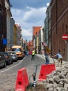 Road works on narrow street in old part of the Torun city in Poland.