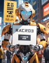 A robot with a poster stands in the city. Made with AI