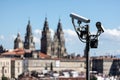 Scene of security cams on pole and Santiago de Compostela Cathedral blurred at background