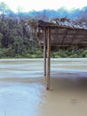 small hut at a flooding river