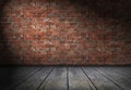 Scene with spotlight on red brick wall background. Empty bricks room with old wooden floor