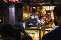 scene at a street kitchen in Dotonbori area at night, Osaka, Japan Royalty Free Stock Photo