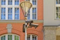 Three security cameras on street lamp
