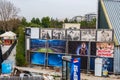 A scene of urban decay comprising abandoned movie posters, fridges and other items in a back-street in Paleo Faliro in Athens Royalty Free Stock Photo