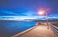 Scene of walk way on the lake when sunset in Gene Coulon Memorial Beach Park,Renton,Washington,usa. Royalty Free Stock Photo