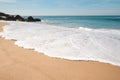 scene of the waves of the Atlantic Ocean reverberating on the sandy beach of Praia da Ilha do Pessegueiro near Porto Covo, western Royalty Free Stock Photo