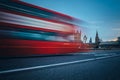 Scene of Westminster Bridge seen from South Bank, quiet morning double decker bus and fast moving