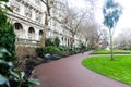 Scene from Whitehall Gardens, London, with couple walking in the park