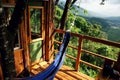 Scenec view from the balcony of a treehouse with a hammock Royalty Free Stock Photo