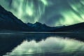 Scenery of Aurora borealis over Rocky Mountains in Medicine Lake at Jasper national park Royalty Free Stock Photo