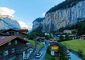 Scenery of beautiful Lauterbrunnen village in the glacial valley with Staubbach waterfall hanging down a rocky cliff Royalty Free Stock Photo