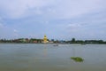 The scenery of the big golden buddha and passenger ship By the Chao Phraya River in Nonthaburi Province