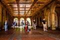 Scenery of blurred passers-by around a guitarist playing in Bethesda Terrace, New York City