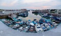 Scenery of boats berthed in Yong-an Fishing Port at dusk, with a bridge over the harbor Royalty Free Stock Photo